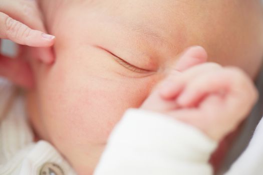 Newborn is sleeping - selective focus