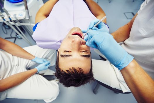 Dentist office - young man in the dentist chair