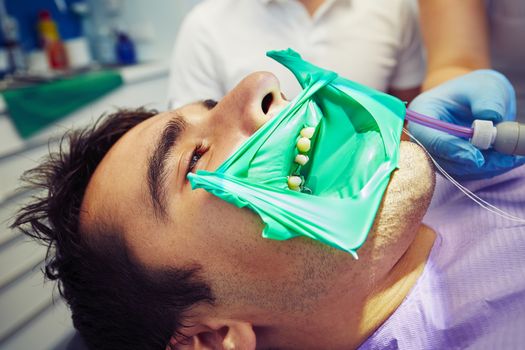 Dentist office - young man in the dentist chair