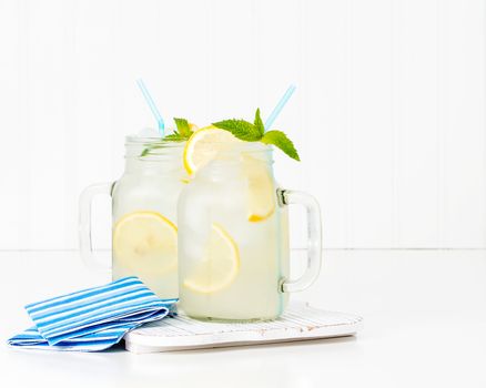 Two jars of ice cold homemade lemonade.