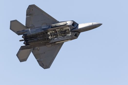 The belly of an F-22 Raptor in flight