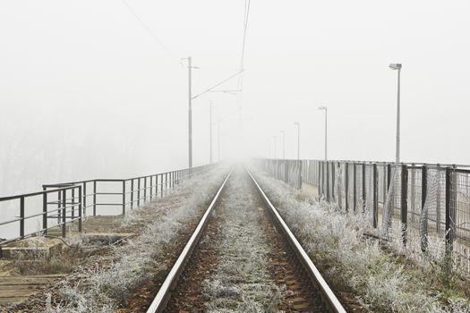 The railway in mystery fog in Prague