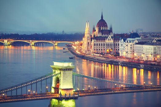 Amazing twilight with The Szechenyi Chain Bridge and Parliament in Budapest - vintage style