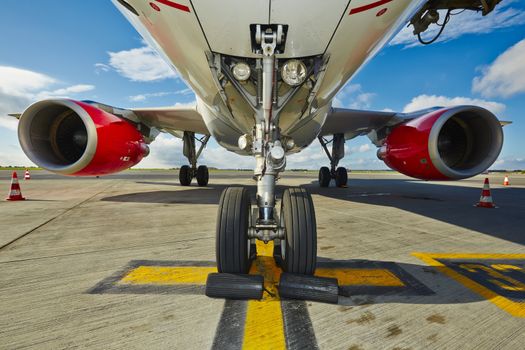 Undercarriage of the aircraft at the airport.