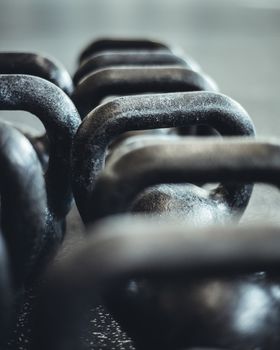 Kettlebells organized and put away at the gym.