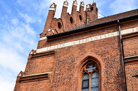 Side of old gothic style catholic church in Olsztyn, Poland