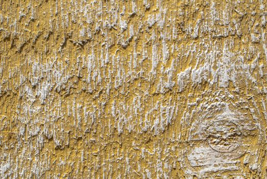 texture of wooden surface with remnants of old paint that has dried and cracked under the influence of weather