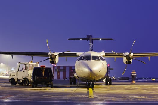 The ground crew is preparing the aircraft for take off.