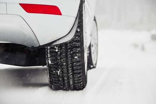 Detail of the tire on winter road