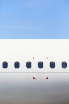 Windows of the white airplane - copy space