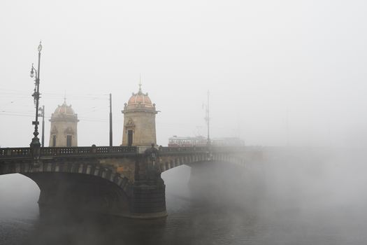 Old bridge in mystery fog, Prague 