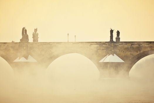 Charles bridge in morning fog, Prague, Czech Republic