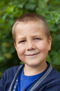 Portrait of a boy close up in nature