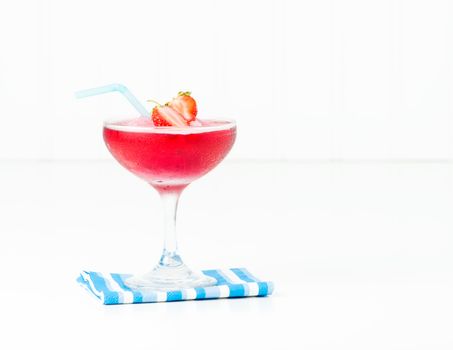 Frozen strawberry cocktail garnished with fresh fruit.