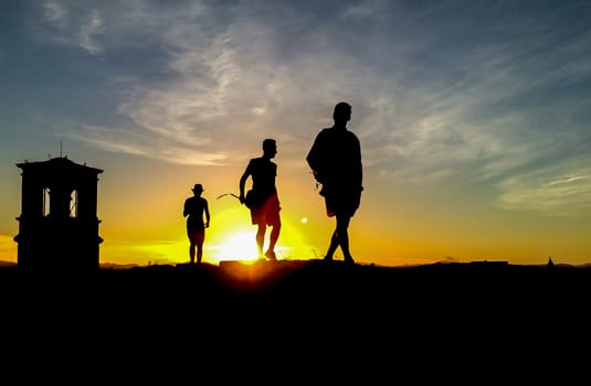 Three silhouette at sunset