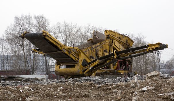 Stone crusher parked by the construction site