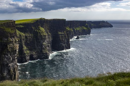 The Cliffs of Moher - located at the southwestern edge of the Burren region in County Clare, Ireland. They rise 120 metres (390 ft) above the Atlantic Ocean at Hag's Head and reach their maximum height of 214 metres (702 ft) here just north of O'Brien's Tower.