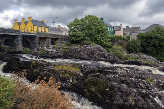 The village of Sneem on the Iveragh Peninsula in County Kerry in the Republic of Ireland. The River Sneem flows through the village.
