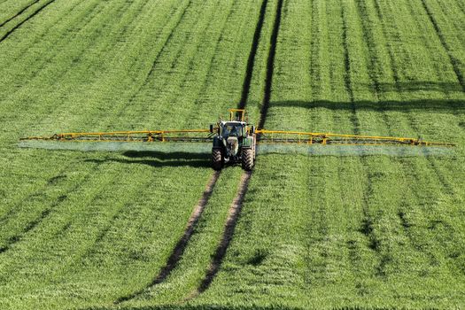 Agriculture - Spraying fertilizer on wheat crop - North Yorkshire - England.