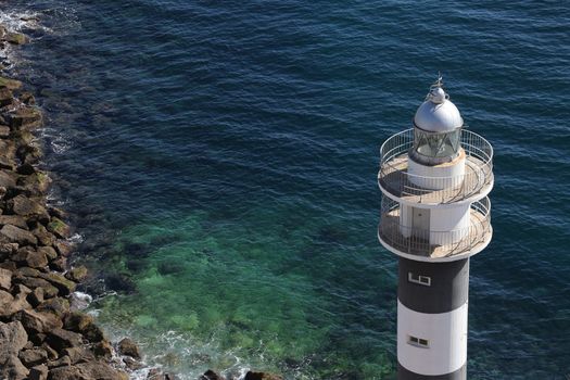 Lighthouse at the harbor entrance in the port of Aguilas on the Costa Calida in Spain