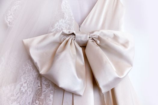 Detail of a wedding dress with bow from a fabric
