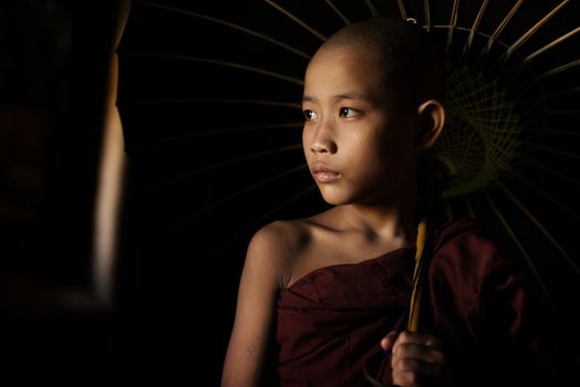 Portrait of young novice monks walking thru a Buddhist temple, Bagan, Myanmar.