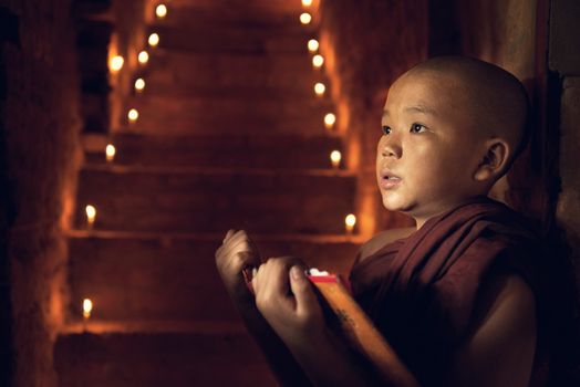 Young Buddhist novice monks learning Buddhist teaching  inside monastery, pagan, Myanmar.