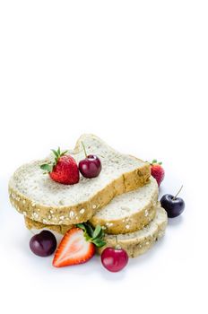 Whole wheat bread with mix berries  over white background