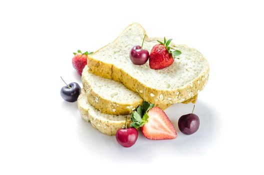 Whole wheat bread with mix berries  over white background