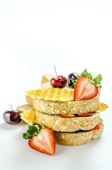 Whole wheat bread with mix berries  over white background