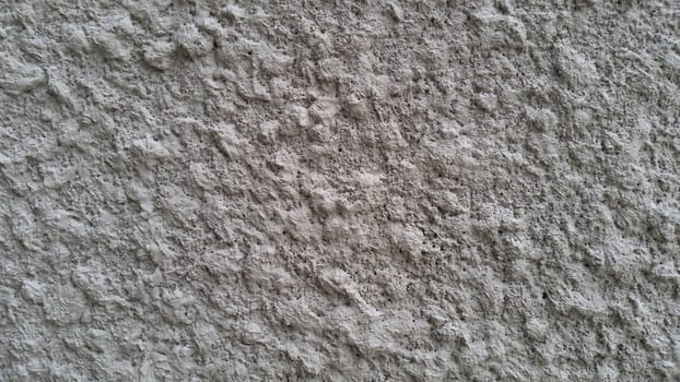 White knobby cement wall backgroud