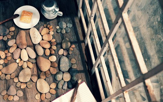 Relax morning for new day with coffee time in cafeteria, abstract cafe interior with table near glass window, pebbles background make group of foot, romantic view for breakfast in vintage color