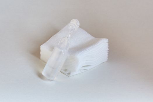 Single use eye drop container with sterile compresses.