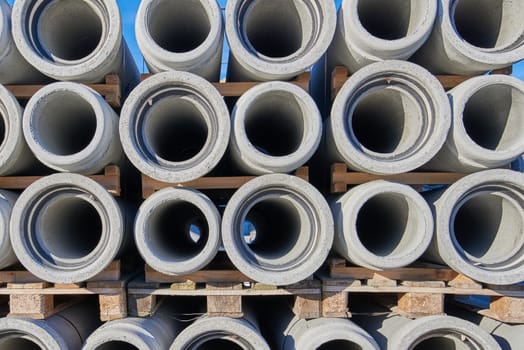 Concrete pipes stacked on pallets.