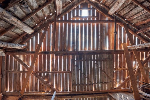 Old barn with sun shining from outside