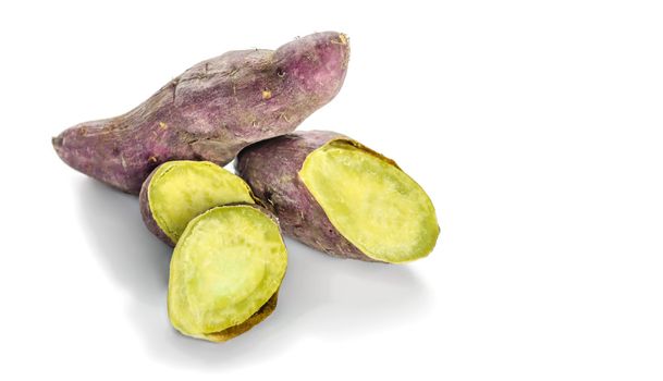 roasted sweet potato with slices isolated on white background