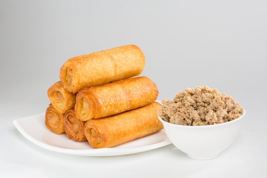 pancakes with meat on white plate. Shallow dof