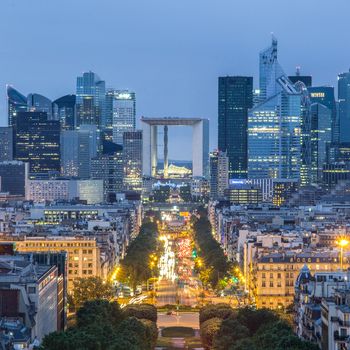 View of La Defence Paris business district from Place Charles De Gaulle at dusk.