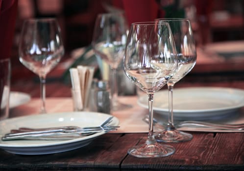 Empty set of glass and plates at restaurant