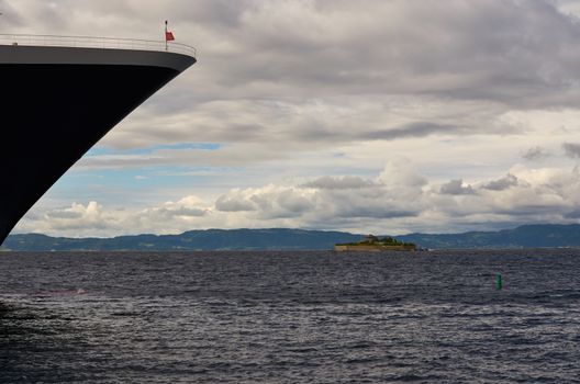 View of Munkholmen, Trondheim, Norway with a cruise ship bow.