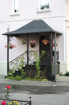 Comfort house. Nice entrance with small staircase and flowerpots