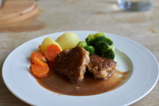 Homemade fish cakes with carrots, potatoes and broccoli