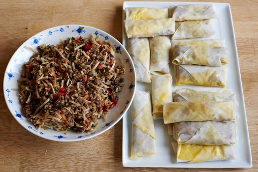 Making of spring rolls before frying.