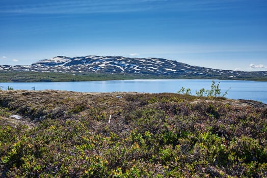 Small lake on top of a mountain.