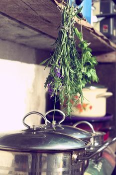 Herbs, hung in the kitchen utility room  - vintage retro color tone