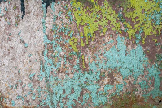 fragment of an iron surface is covered with paint, which has long been under the influence of different climatic conditions
