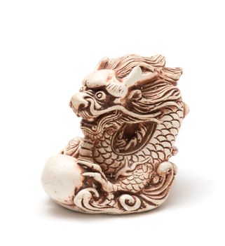 Netsuke of east dragon, which guarding the egg. A miniature sculpture, which was used as a button-like trinket in traditional Japanese clothes kimono kosode, which was devoid of pockets.