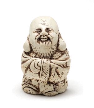 Netsuke of a satisfied man in a dressing gown. Isolated. A miniature sculpture, which was used as a button-like trinket in traditional Japanese clothes kimono kosode, which was devoid of pockets.