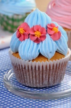 Muffin decorated with a delicate cream closeup