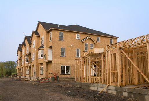 A housing complex under construction in various stages of development